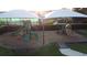 playground with two playsets and shade structures at 10090 Sunnifa Aly, Orlando, FL 32832