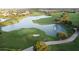 Aerial view of a golf course with ponds and landscaping at 10090 Sunnifa Aly, Orlando, FL 32832