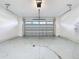 Spacious garage with overhead door and ample storage space at 10090 Sunnifa Aly, Orlando, FL 32832