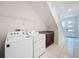 Laundry room with washer, dryer, and built-in cabinets at 10090 Sunnifa Aly, Orlando, FL 32832