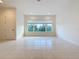 Bright living area with large windows and tile flooring at 10090 Sunnifa Aly, Orlando, FL 32832