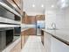 Modern kitchen with stainless steel appliances and granite countertops at 10090 Sunnifa Aly, Orlando, FL 32832