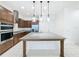 Spacious kitchen with island, stainless steel appliances, and granite counters at 10090 Sunnifa Aly, Orlando, FL 32832