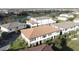 Community view showing townhomes near a lake at 10090 Sunnifa Aly, Orlando, FL 32832