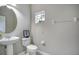 Simple half bathroom with toilet and pedestal sink at 1060 Rock Harbor Ave, Orlando, FL 32828