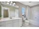 Clean bathroom with a tub, toilet and vanity at 1060 Rock Harbor Ave, Orlando, FL 32828