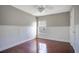 Well-lit bedroom with hardwood floors and wainscoting at 1060 Rock Harbor Ave, Orlando, FL 32828