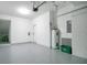 Garage with epoxy floor, water heater and storage at 1060 Rock Harbor Ave, Orlando, FL 32828