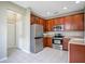 Kitchen features stainless steel appliances and wood cabinets at 1060 Rock Harbor Ave, Orlando, FL 32828