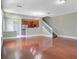 Spacious living room with hardwood floors and view of kitchen at 1060 Rock Harbor Ave, Orlando, FL 32828
