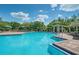 Community pool with lounge chairs and shaded seating areas at 1060 Rock Harbor Ave, Orlando, FL 32828