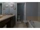 Bathroom with soaking tub, double vanity, and separate toilet area at 1748 Portofino Meadows Blvd, Orlando, FL 32824