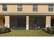 Spacious screened patio with a grill and seating area at 1748 Portofino Meadows Blvd, Orlando, FL 32824