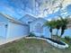 Curb appeal! Newly painted light blue house with stone landscaping at 2907 Delcrest Dr, Orlando, FL 32817