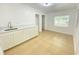 Newly remodeled kitchenette featuring white cabinets and tile floors at 2907 Delcrest Dr, Orlando, FL 32817