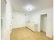 Bright white kitchenette with quartz countertops and tile floor at 2907 Delcrest Dr, Orlando, FL 32817