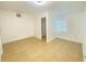 Bright bedroom with access to a full bathroom and tile floors at 2907 Delcrest Dr, Orlando, FL 32817
