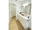 Modern bathroom with double vanity and white cabinets at 2907 Delcrest Dr, Orlando, FL 32817