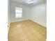 Bright bedroom with tile floors and a ceiling light at 2907 Delcrest Dr, Orlando, FL 32817