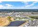 Aerial view of resort, pool, and surrounding area at 3075 Key Lime Loop, Kissimmee, FL 34747