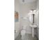 Small half bathroom with pedestal sink and toilet at 3075 Key Lime Loop, Kissimmee, FL 34747