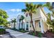 Row of colorful houses, including a yellow house with orange accents and palm trees at 3075 Key Lime Loop, Kissimmee, FL 34747