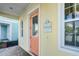 Light orange front door with a house number and street name at 3075 Key Lime Loop, Kissimmee, FL 34747