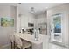 Modern kitchen with stainless steel appliances and a breakfast bar at 3075 Key Lime Loop, Kissimmee, FL 34747