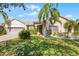 Single-story home with a two-car garage and landscaped lawn at 3643 Weatherfield Dr, Kissimmee, FL 34746