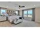 Main bedroom with a king-size bed and stunning views at 3740 Deer Ridge Dr, Mount Dora, FL 32757