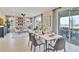 Open concept dining area with a marble table and access to a patio at 3740 Deer Ridge Dr, Mount Dora, FL 32757