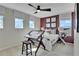 Bedroom with a queen bed, window seat, and modern decor at 3740 Deer Ridge Dr, Mount Dora, FL 32757