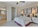 Cozy bedroom with a queen-size bed and ensuite bathroom at 3740 Deer Ridge Dr, Mount Dora, FL 32757