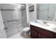 Clean bathroom with shower, toilet, and modern vanity at 468 Andalusia Loop, Davenport, FL 33837