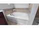 Bathroom with a large garden tub at 468 Andalusia Loop, Davenport, FL 33837