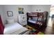 ' bedroom with twin bed, bunk bed, and playful decor at 468 Andalusia Loop, Davenport, FL 33837