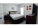 Cozy bedroom with double bed, nightstand, and decorative wall art at 468 Andalusia Loop, Davenport, FL 33837