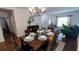 Bright dining room with a wooden table and seating for six at 468 Andalusia Loop, Davenport, FL 33837