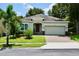 One-story house with a two-car garage and well-maintained lawn at 468 Andalusia Loop, Davenport, FL 33837