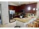 Kitchen with granite countertops and stainless steel appliances at 468 Andalusia Loop, Davenport, FL 33837