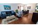 Open living and dining area with hardwood floors at 468 Andalusia Loop, Davenport, FL 33837