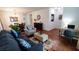 Spacious living room with hardwood floors and comfortable seating at 468 Andalusia Loop, Davenport, FL 33837