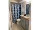 Clean bathroom with a shower/tub combo and updated vanity at 5140 Conroy Rd # 38, Orlando, FL 32811