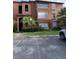 Two-story building with Mediterranean-style architecture and parking at 5140 Conroy Rd # 38, Orlando, FL 32811