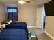Spacious bedroom with two twin beds and access to a bathroom at 5140 Conroy Rd # 38, Orlando, FL 32811