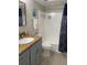 Bathroom with a tub, shower, and updated vanity at 5140 Conroy Rd # 38, Orlando, FL 32811