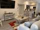 Open living room with modern furnishings and hardwood floors at 5140 Conroy Rd # 38, Orlando, FL 32811