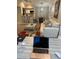 Open living room with a comfortable sofa and adjacent kitchen at 5140 Conroy Rd # 38, Orlando, FL 32811