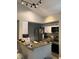 Modern kitchen with stainless steel appliances and granite countertops at 5140 Conroy Rd # 38, Orlando, FL 32811
