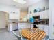 Bright kitchen with stainless steel appliances and white cabinets at 516 Millifiora Ln, Kissimmee, FL 34759